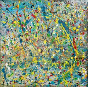 Abstract acrylic painting with vivid splatters and strokes of yellow, red, green, and blue over a soft blue and grey background, creating energetic movement and layered texture.